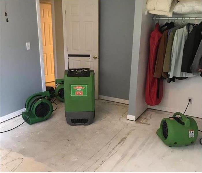 Dryer machines drying a water loss in a home